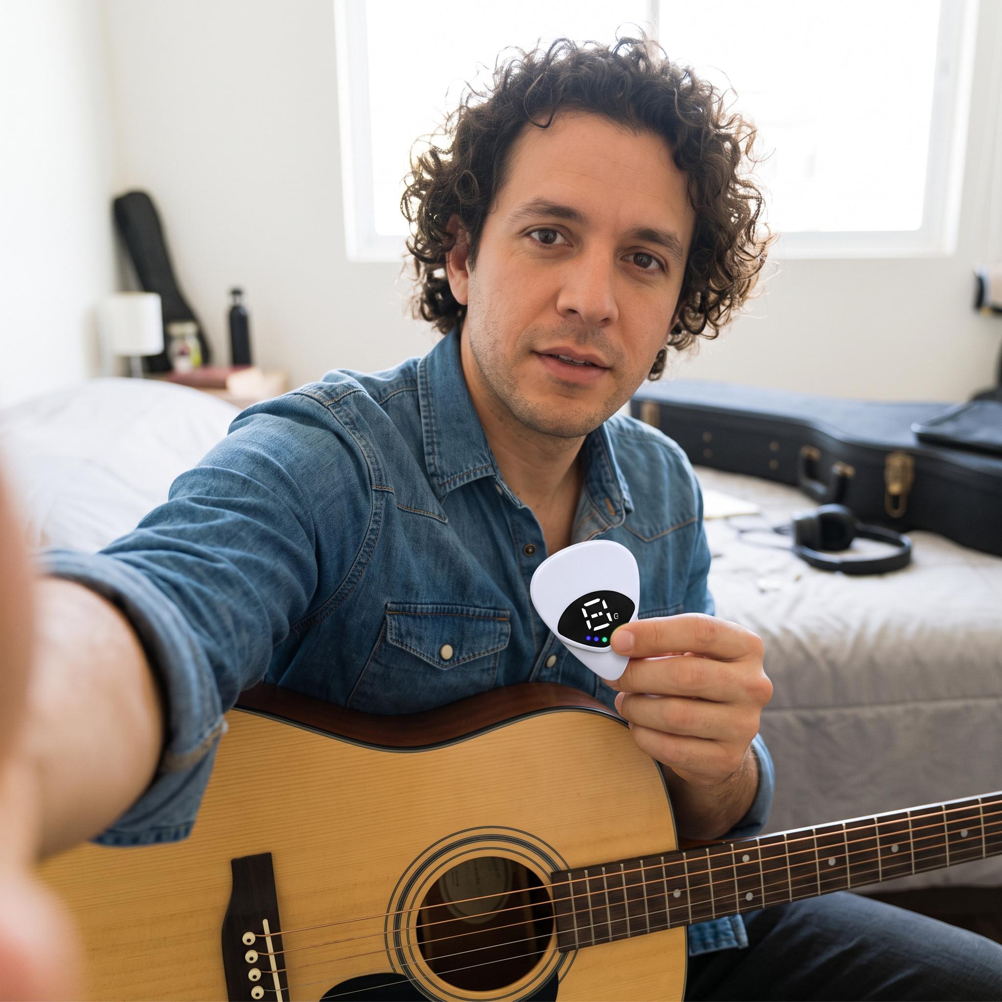 White tuner pick beside a ukulele